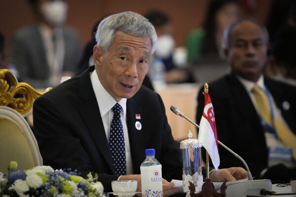 FILE - Singapore's Prime Minister Lee Hsien Loong speaks during ASEAN - India Summits in Phnom Penh, Cambodia, on Nov. 12, 2022.Singapore Prime Minister Lee Hsien Loong said Sunday, Nov. 5, 2023 he planned to bow out and hand over power to his deputy, Lawrence Wong, late next year, before the 2025 general election. Lee, 71, initially intended to retire before turning 70, but it was shelved because of the COVID-19 pandemic. (AP Photo/Anupam Nath, file)