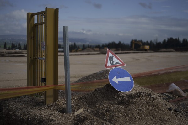 A sign is displayed at a construction site where houses will be built for displaced residents of Kibbutz Nahal Oz, at Kibbutz Mishmar HaEmek, northern Israel, Feb. 4, 2024. (AP Photo/Leo Correa)