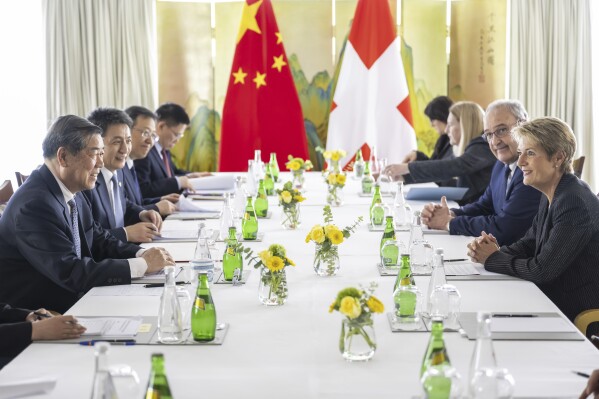 Chinese Vice Premier He Lifeng, Switzerland's Economy Minister Federal Councillor Guy Parmelin and Switzerland's President Karin Keller-Sutter speak, during a bilateral meeting on Friday, May 9, 2025. (Martial Trezzini/Keystone via AP, Pool)