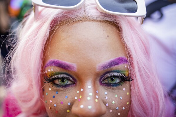 A reveler poses for a photo during the annual Gay Pride Parade in Sao Paulo, Brazil, Sunday, June 11, 2023. (AP Photo/Tuane Fernandes)