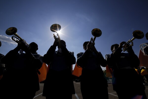 File - The Southern University Human Jukebox marching band warms up before the 2023 National Battle of the Bands at NRG Stadium, Saturday, Aug. 26, 2023, in Houston. Student loan payments resume in October after a three-year pause due to the pandemic. (Ǻ Photo/Michael Wyke, File)