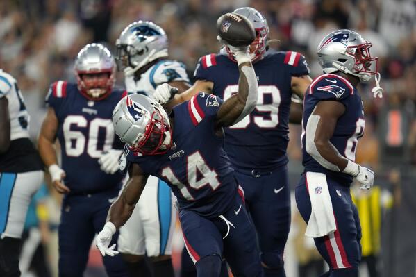 New England Patriots wide receiver Nelson Agholor (15) heads for the end  zone after a touchdown pass from New England Patriots quarterback Mac Jones  during the first half of an NFL football