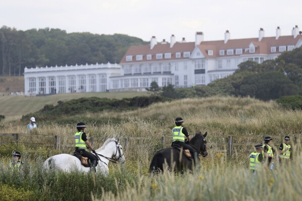 Police patrol near the Trump Turnberry golf resort, in Turnberry, Scotland, Saturday, July 14, 2018. (AP Photo/Peter Morrison, File)