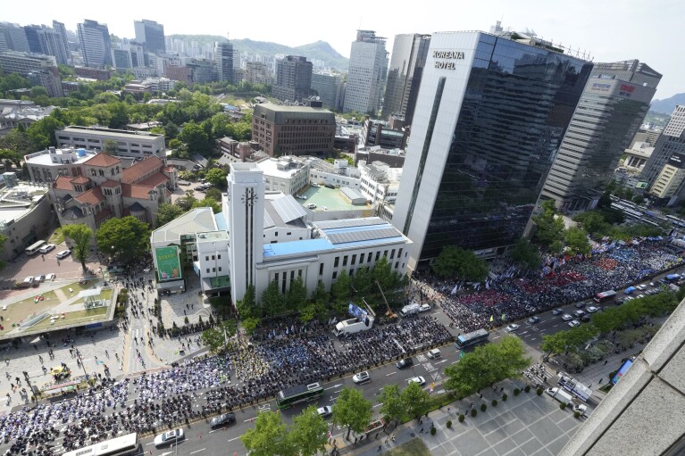 Members of the Korean Federation of Trade Unions gather for a Labor Day rally in Seoul, South Korea, Wednesday, May 1, 2024. Workers, activists and others in Asian capitals took to the streets Wednesday to mark Labor Day with protests against rising prices, government labor policies and calls for more workers' rights.  (AP Photo/Ahn Young Joon)