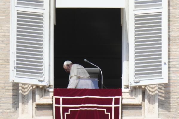 Pope Francis leaves after the Angelus noon prayer from the window of his studio overlooking St.Peter's Square, at the Vatican, Sunday, Oct. 2, 2022. Pope Francis has appealed to Russian President Vladimir Putin, imploring him to "stop this spiral of violence and death" in Ukraine. The pontiff also called on Ukrainian President Volodymyr Zelenskyy to "be open" to serious peace proposals. (AP Photo/Alessandra Tarantino)