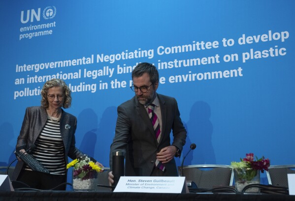 FILE - United Nations Environment Programme Executive Director Inger Andersen and Environment and Climate Change Minister Steven Guilbeault take their seats at a news conference, April 23, 2024 in Ottawa, Ontario. (Adrian Wyld/The Canadian Press via AP, File)