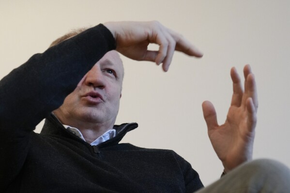 Dragan Djilas, a former mayor of Belgrade who is now one of the leaders of a pro-European coalition gestures during an interview with The Associated Press, in Belgrade, Serbia, Wednesday, Nov. 22, 2023. Serbian President Aleksandar Vucic regularly blasts Djilas and other opposition leaders as enemies of the state and "thieves" who are taking instructions from Western embassies. Mainstream pro-government media give them no opportunity to respond to the allegations. (AP Photo/Darko Vojinovic)