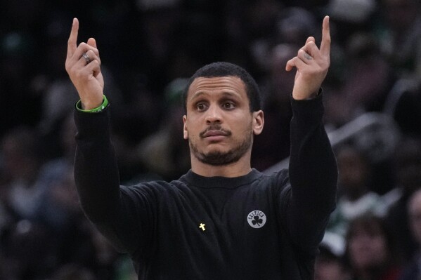 Boston Celtics head coach Joe Mazzulla calls to his players during the first half of an NBA basketball game against the Brooklyn Nets, Wednesday, Feb. 14, 2024, in Boston. (AP Photo/Charles Krupa)