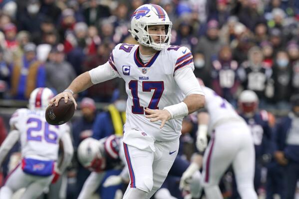 Buffalo Bills quarterback Josh Allen (17) looks to pass during the first half of an NFL football game against the New England Patriots, Sunday, Dec. 26, 2021, in Foxborough, Mass. (AP Photo/Steven Senne)