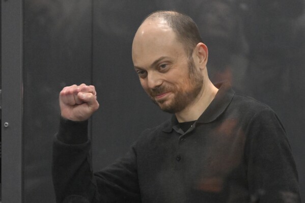 FILE - Russian opposition activist Vladimir Kara-Murza gestures while standing in a glass cage in a courtroom during the announcement of the verdict on appeal at the Moscow City Court on July 31, 2023. (AP Photo, File)