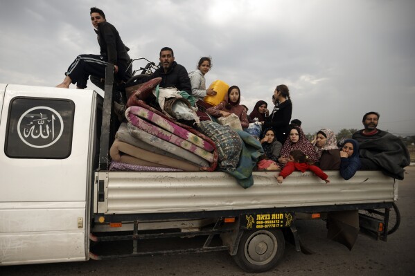 Palestinians flee the Israeli ground offensive in Khan Younis, Gaza Strip, Wednesday, Dec. 27, 2023. (AP Photo/Mohammed Dahman)