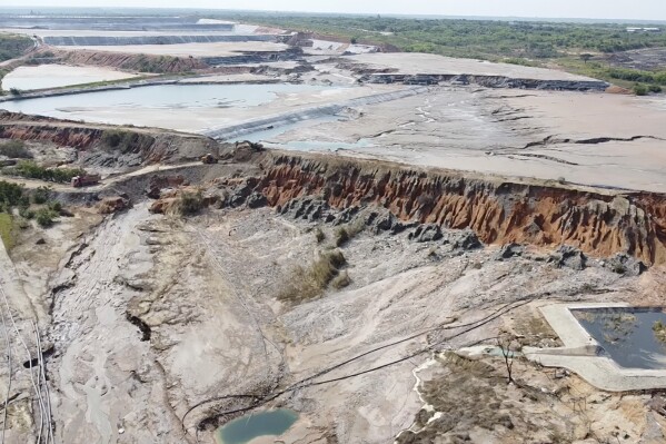 This image taken from video Wednesday, Feb. 19, 2025, shows a breach at a tailing dam at a Sino-Metals Leach Zambia mine near Kitwe. (AP Photo/Richard Kille )