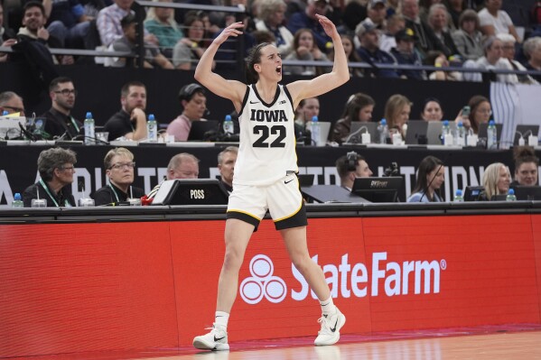 Iowa guard Caitlin Clark (22) cheers while checking out of the game during the second half of an NCAA college basketball quarterfinal game against Penn State at the Big Ten women's tournament Friday, March 8, 2024, in Minneapolis. (AP Photo/Abbie Parr)