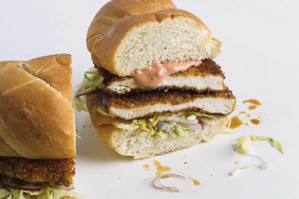 This image released by Milk Street shows a recipe for a breaded chicken cutlet sandwich. Thin breaded chicken cutlets fry up in minutes, and are terrific made into sandwiches or served with dipping sauces. (Milk Street via AP)