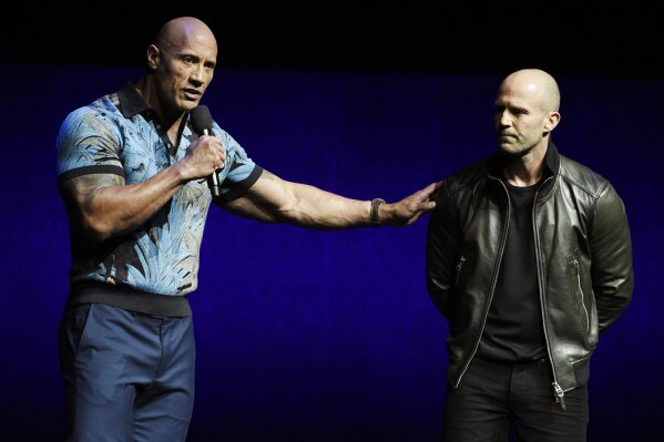 
              Dwayne Johnson, left, and Jason Statham, cast members in the upcoming film "Fast and Furious Presents: Hobbs & Shaw," appear during the Universal Pictures presentation at CinemaCon 2019, the official convention of the National Association of Theatre Owners (NATO) at Caesars Palace, Wednesday, April 3, 2019, in Las Vegas. (Photo by Chris Pizzello/Invision/AP)
            