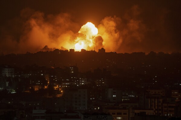 Fire and smoke rise following an Israeli airstrike, in Gaza City, Sunday, Oct. 8, 2023. The militant Hamas rulers of the Gaza Strip carried out an unprecedented, multi-front attack on Israel at daybreak Saturday, firing thousands of rockets as dozens of Hamas fighters infiltrated the heavily fortified border in several locations, killing hundreds and taking captives. Palestinian health officials reported scores of deaths from Israeli airstrikes in Gaza. (AP Photo/Fatima Shbair)