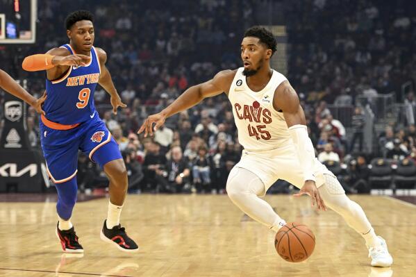 Cleveland Cavaliers guard Donovan Mitchell (45) drives during the first half of an NBA basketball game against the New York Knicks, Sunday, Oct. 30, 2022, in Cleveland. (AP Photo/Nick Cammett)