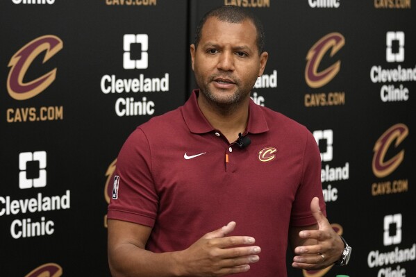 Koby Altman, the president of basketball operations for the Cleveland Cavaliers, answers a question at a news conference in Independence, Ohio, May 24, 2024. (AP Photo/Sue Ogrocki, File)