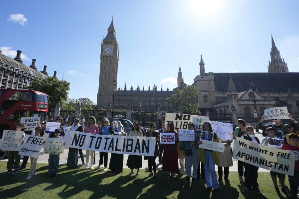 People protest in Parliament Square at the anniversary of the Taliban takeover of Afghanistan in London, Tuesday, Aug. 15, 2023. The Afghanistan and Central Asian Association has organised a peaceful protest outside Parliament in solidarity with the people of Afghanistan, to oppose the Taliban government and to mark two years of the return of the Taliban in Afghanistan. (AP Photo/Frank Augstein)