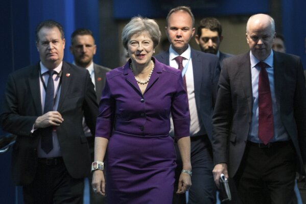 
              Britain's Prime Minister Theresa May arrives at the Conservative Party annual conference at the International Convention Centre, Birmingham, central England, Tuesday Oct. 2, 2018. (Stefan Rousseau/PA via AP)
            