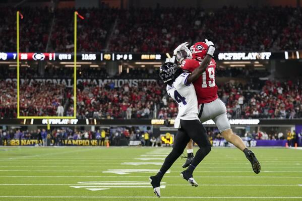 Georgia tight end Brock Bowers (19) makes a touchdown catch against TCU safety Abraham Camara (14) during the second half of the national championship NCAA College Football Playoff game, Monday, Jan. 9, 2023, in Inglewood, Calif. (AP Photo/Marcio Jose Sanchez)