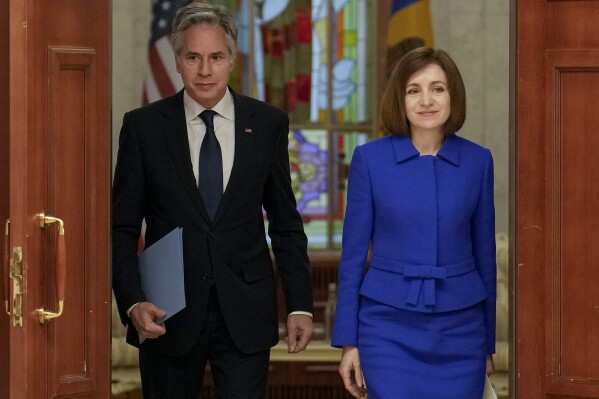 United States Secretary of State Antony Blinken, left, and Moldova's President Maia Sandu, right, arrive to give a joint press conference at the Moldovan Presidency in Chisinau, Moldova, Wednesday, May 29, 2024. (AP Photo/Vadim Ghirda, Pool)