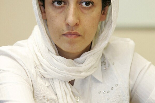 FILE - Iranian activist Narges Mohammadi, delegate of the Center for Human Rights Defenders, attends a press conference in the U.N. headquarters in Geneva, Switzerland, June 9, 2008. A campaign urging Iran to free Nobel Peace Prize laureate Narges Mohammadi said Monday, Nov. 6, 2023, that the activist had started a hunger strike over the conditions of her imprisonment and the country's mandatory headscarf for women. (Magali Girardin/Keystone via AP, File)