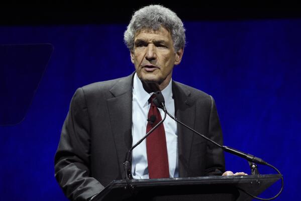 FILE - Alan Horn, chairman of The Walt Disney Studios, addresses the audience during the Walt Disney Studios Motion Pictures presentation at CinemaCon 2019 on April 3, 2019, in Las Vegas. Horn, the film executive who helped turn Walt Disney Studios into the most powerful movie studios in Hollywood, is retiring. Disney announced Monday that Horn, 78, will step down at the end of the year. (Photo by Chris Pizzello/Invision/AP, File)