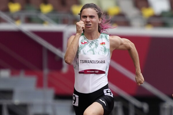 FILE - Krystsina Tsimanouskaya, of Belarus, runs in the women's 100-meter run at the 2020 Summer Olympics, Japan, on July 30, 2021. An Olympic track coach who tried to force Krystsina Tsimanouskaya home from the Tokyo Games to Belarus where she feared for her safety was banned from the sport for five years on Tuesday, Feb. 27, 2024. (AP Photo/Martin Meissner, File)