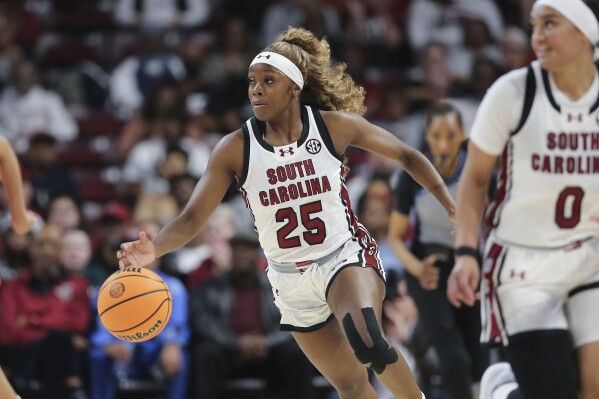 South Carolina guard Raven Johnson (25) advances the ball up the court during the first half of an NCAA college basketball game against Georgia, Sunday, Feb. 18, 2024, in Columbia, S.C. (AP Photo/Artie Walker Jr.)