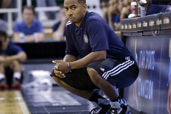 FILE - Utah Jazz coach Johnnie Bryant looks on during the second half of an NBA summer league basketball game against the Boston Celtics, July 5, 2016, in Salt Lake City. The Cleveland Cavaliers added two more candidates to its coaching search Friday, May 31, 2024, receiving permission to interview current New York Knicks assistant head coach Bryant and Miami Heat assistant Chris Quinn, a person familiar with the process told The Associated Press. (AP Photo/Rick Bowmer, File)