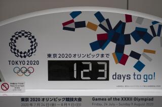 A countdown clock for the Tokyo 2020 Olympics is photographed in Tokyo, Monday, March 23, 2020. The IOC will take up to four weeks to consider postponing the Tokyo Olympics amid mounting criticism of its handling of the coronavirus crisis that now includes Canada saying it won't send a team to the games this year and the leader of track and field, the biggest sport at the games, also calling for a delay. (AP Photo/Jae C. Hong)