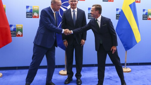 Turkey's President Recep Tayyip Erdogan, left, shakes hands with Sweden's Prime Minister Ulf Kristersson, right, as NATO Secretary General Jens Stoltenberg looks on prior to a meeting ahead of a NATO summit in Vilnius, Lithuania, Monday, July 10, 2023. (Yves Herman, Pool Photo via AP)