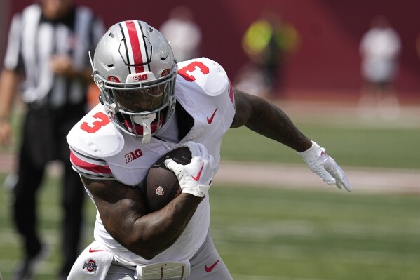 Ohio State running back Miyan Williams runs for a touchdown during the first half of an NCAA college football game against Indiana, Saturday, Sept. 2, 2023, in Bloomington, Ind. (AP Photo/Darron Cummings)