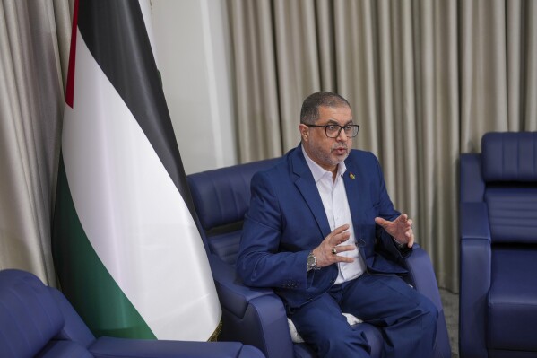 Bassem Naim, an official in Hamas' political wing, speaks in Istanbul, Turkey, Thursday, Dec. 5, 2024. (AP Photo/Francisco Seco)