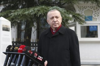 Turkey's President Recep Tayyip Erdogan speaks to the media after Friday prayers, in Istanbul, Friday, Jan. 15, 2021. Turkey’s president has criticized the United States for kicking his country out of the F-35 fighter jet program after Ankara purchased a Russian missile defense system. Speaking after Friday prayers in Istanbul, Turkish President Recep Tayyip Erdogan said Turkey paid “very serious money” for the F-35 stealth jets and that America had committed “a very serious mistake” with its NATO ally. (Turkish Presidency via AP, Pool)