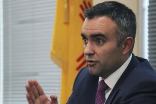 FILE - Bernalillo County District Attorney Raul Torrez speaks to a panel of New Mexico lawmakers during a meeting in Albuquerque, N.M., Sept. 27, 2017. Torrez is running against State Auditor Brian Colón for the Democratic endorsement to succeed termed-out Democratic Attorney General Hector Balderas. Absentee and early in-person vote were underway Thursday, June 2, 2022, in advance of Election Day next Tuesday. (AP Photo/Susan Montoya Bryan, File)
