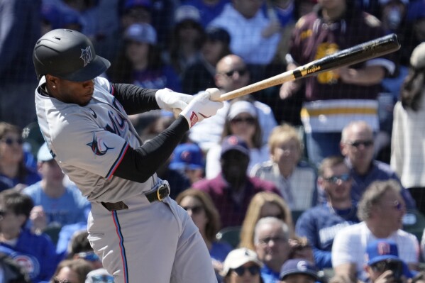 Miami Marlins' Tim Anderson hits a one-run single during the fourth inning of a baseball game against the Chicago Cubs in Chicago, Sunday, April 21, 2024. (AP Photo/Nam Y. Huh)