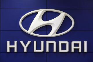 FILE - This July 26 2018 file photo shows the logo of Hyundai Motor Co. in Seoul, South Korea.  Hyundai plans to invest $7.4 billion in the U.S. by 2025 to make electronic vehicles, enhance production facilities and invest further in smart mobility solutions. Hyundai Motor Group, which includes Hyundai Motor Co. and Kia Corp., said Thursday, May 13, 2021,  that Hyundai and Kia will invest in growing its electronic manufacturing footprint to scale production and satisfy U.S. market demands.   (AP Photo/Ahn Young-joon, File)