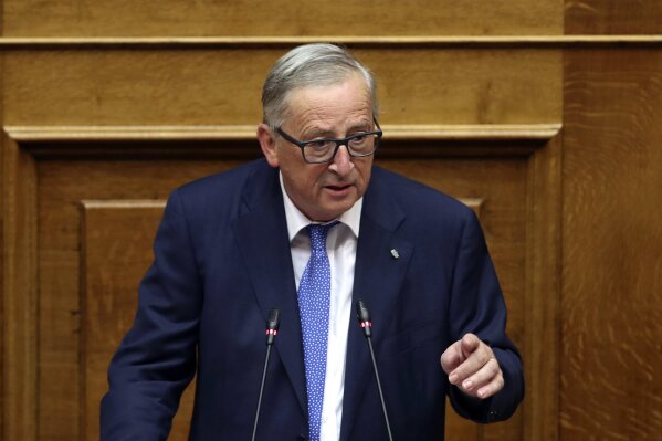 
              FILE - In this Thursday, April 26, 2018 file photo, European Commission President Jean-Claude Juncker delivers a speech to Greek lawmakers during a parliamentary session in Athens. Juncker is appealing to Belgium to grant nationality to Britons who work at the European Union's vast executive arm, as Brexit approaches next year. Amid praise for Belgian Prime Minister Charles Michel Thursday, May 3, Juncker said he hoped that "Belgian authorities show the same generosity when it comes to granting Belgian nationality to British public servants who are here in Brussels." (AP Photo/Petros Giannakouris, file)
            