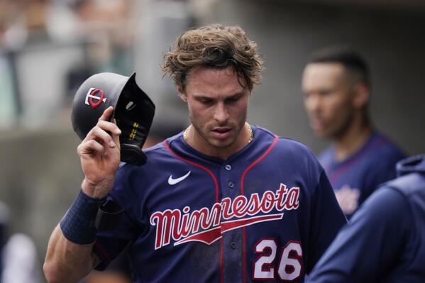Minnesota Twins' Max Kepler walks in the dugout after being replaced with a pinch runner during the third inning of a baseball game against the Detroit Tigers, Sunday, July 24, 2022, in Detroit. (AP Photo/Carlos Osorio)
