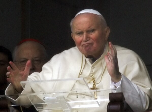 Pope John Paul II appears at a window of his rooms of the 10th floor of Rome's Gemelli Polyclinic Hospital, Sunday, March 13, 2005. (AP Photo/Lionel Cironneau, File)