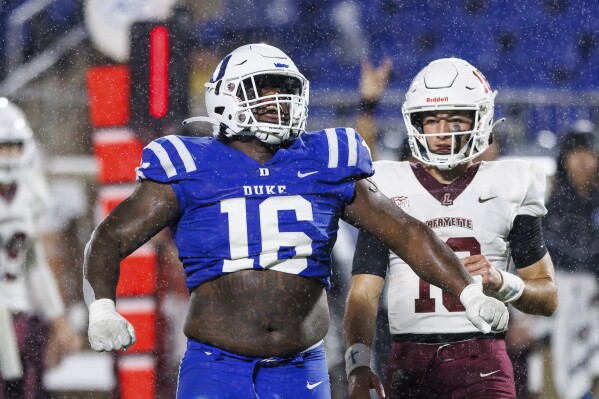 Duke's Aeneas Peebles, left, celebrates in front of Lafayette's Dean DeNobile after making a tackle during the second half of an NCAA college football game in Durham, N.C., Saturday, Sept. 9, 2023. (AP Photo/Ben McKeown)