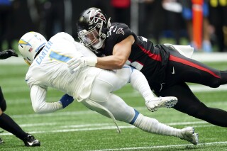 FILE - Los Angeles Chargers' DeAndre Carter (1) is tackled by Atlanta Falcons' Nick Kwiatkoski while returning a punt during the first half of an NFL football game Nov. 6, 2022, in Atlanta. Kwiatkoski signed a one-year deal with the Pittsburgh Steelers on Tuesday, June 20, 2023. (AP Photo/John Bazemore, File)