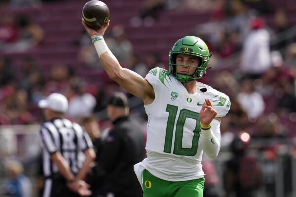 Oregon quarterback Bo Nix warms up before the team's NCAA college football game against Stanford on Saturday, Sept. 30, 2023, in Stanford, Calif. (AP Photo/Godofredo A. Vásquez)