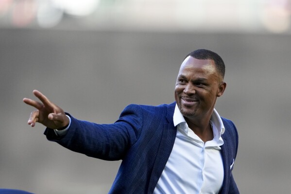 FILE - Former major league player Adrian Beltre waves as he arrives during the induction ceremony for former pitcher Félix Hernández into the Mariners Hall of Fame before a baseball game between the Mariners and the Baltimore Orioles, Saturday, Aug. 12, 2023, in Seattle. Beltré, Joe Mauer, Chase Utley, David Wright, José Bautista and Matt Holliday are among 12 new candidates on the Hall of Fame's ballot for the Baseball Writers' Association of America. (AP Photo/Lindsey Wasson, File)