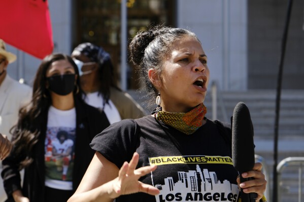 FILE - In this Aug. 5, 2020 file photo, Melina Abdullah speaks during a Black Lives Matter protest at the Hall of Justice in downtown Los Angeles. Abdullah on Thursday, May 23, 2024, lost her lawsuit against the city's police department over its handling of hoax calls that brought a large law enforcement response to her home four years ago. (AP Photo/Richard Vogel, File)