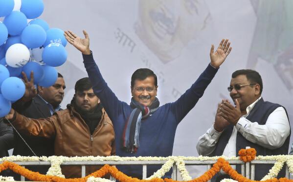 Incumbent Delhi Chief Minister Arvind Kejriwal, center, waves at Aam Aadmi Party, or "common man's" party headquarters as they celebrate the party's victory in New Delhi, India, Tuesday, Feb. 11, 2020. Indian Prime Minister Narendra Modi's Hindu nationalist party was facing a stunning defeat by a regional party Tuesday in elections in the national capital that were seen as a referendum on Modi's policies such as a new national citizenship law that excludes Muslims. (AP Photo/Manish Swarup)