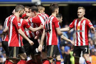 FILE - Sunderland players celebrate after scoring the opening goal during the English Premier League soccer match between Chelsea and Sunderland at Stamford Bridge stadium in London, Sunday, May 21, 2017. Sunderland is within reach of a return to the Premier League after a chaotic and often farcical six years during which the club has the subject of a Netflix documentary. “Sunderland ’Til I Die" is a fly-on-the-wall show charting the team's journey after relegation from England's top division in 2017. (AP Photo/Kirsty Wigglesworth, File)