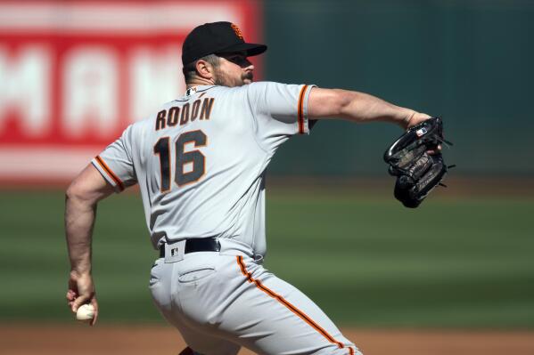 San Francisco Giants starting pitcher Carlos Rodón delivers a pitch against the Oakland Athletics during the first inning of a baseball game Saturday, Aug. 6, 2022, in Oakland, Calif. (AP Photo/D. Ross Cameron)